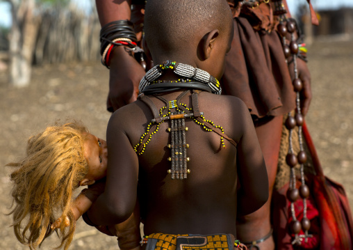 Himba Child Holding A Doll, Epupa, Namibia