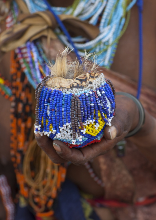Bushman Woman Using A Turtle Shell As A Box, Tsumkwe, Namibia