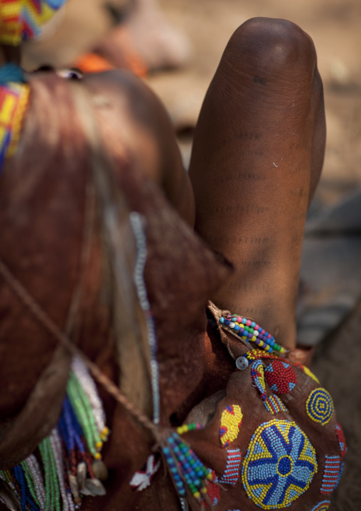 San Woman With Scarifcations On The Legs And A Bag Decorated With Beads, Namibia