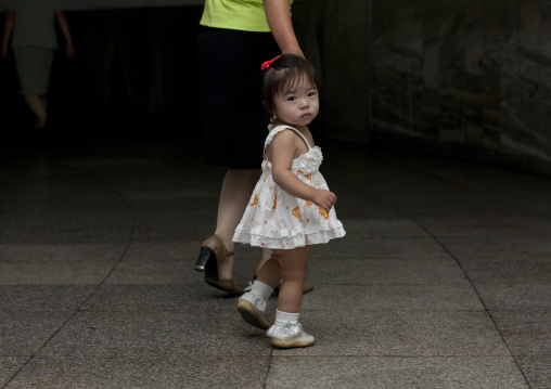 North Korean girl with her mother in the street, Pyongan Province, Pyongyang, North Korea