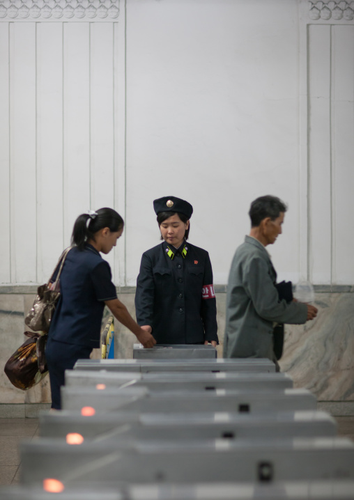 North korean people entering the ticket control machine in the subway, Pyongan Province, Pyongyang, North Korea