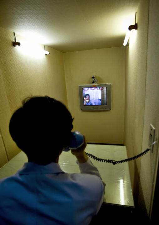 North Korean man speaking to her wife by videoconference after she had a baby in the maternity to prevent from bacteria, Pyongan Province, Pyongyang, North Korea