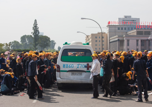 Ambulance passing in the middle of North Korean teenagers during the celebration of the 60th anniversary of the regim, Pyongan Province, Pyongyang, North Korea