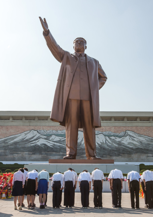 North Korean people bowing in front of the Kim il Sung statue in Mansudae Grand monument, Pyongan Province, Pyongyang, North Korea