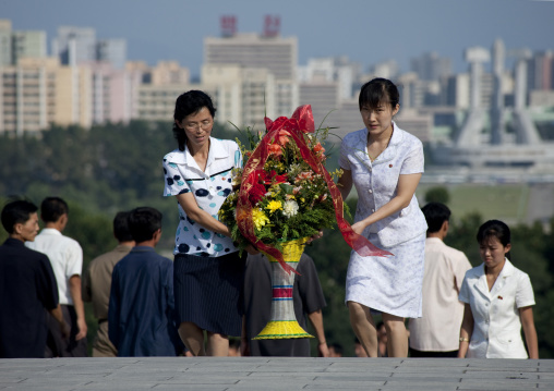 North Korean women bringing flowers in Mansudae Grand monument, Pyongan Province, Pyongyang, North Korea