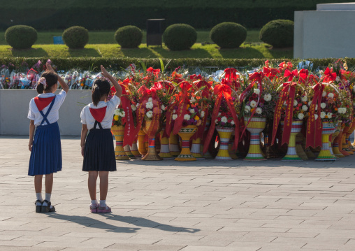 North Korean pioneers girls saluting in Mansudae Grand monument, Pyongan Province, Pyongyang, North Korea