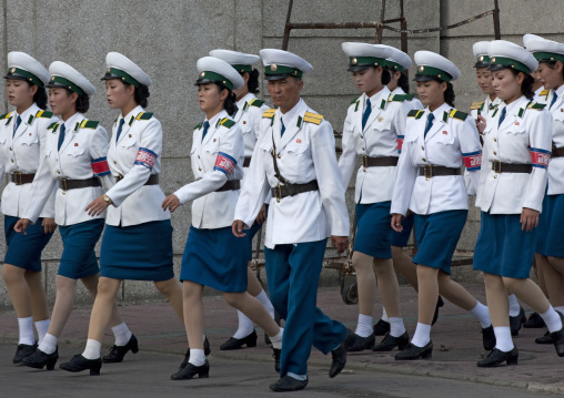 Group of North Korean traffic security officers in white uniforms in the street, Pyongan Province, Pyongyang, North Korea