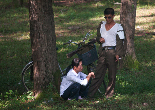 North Korean soldier with his girlfriend in a park, Pyongan Province, Pyongyang, North Korea