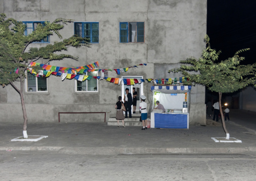 Little shop in front of a building at night, Pyongan Province, Pyongyang, North Korea