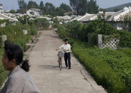 North Korean man with a bicycle in the countryside, Kangwon Province, Chonsam Cooperative Farm, North Korea