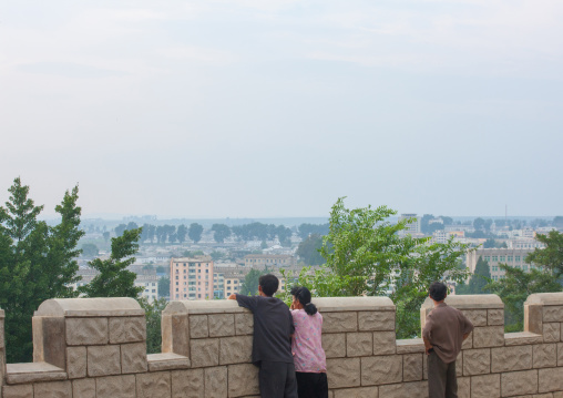 North Korean people looking the city from a hill from the ramparts, North Hwanghae Province, Sariwon, North Korea