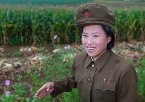 Smiling North Korean female soldier in the countryside, North Hwanghae Province, Kaesong, North Korea