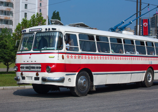Public bus with red stars one star represents 50000 km of safe driving, Pyongan Province, Pyongyang, North Korea