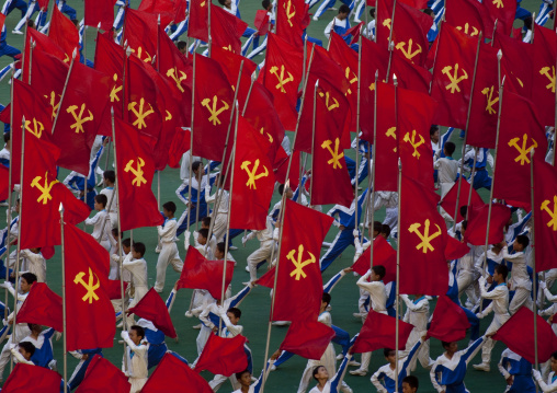 North Korean gymnasts with workers' Party of North Korea flags during the Arirang mass games in may day stadium, Pyongan Province, Pyongyang, North Korea