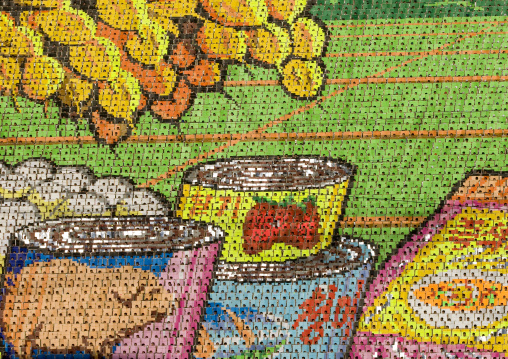 Food cans made by children pixels holding up colored boards during Arirang mass games in may day stadium, Pyongan Province, Pyongyang, North Korea
