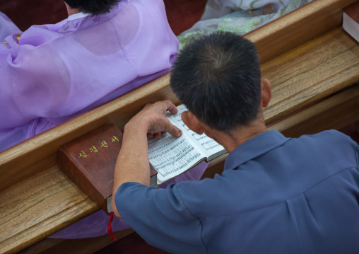 North Korean worshiper reading the bible during a sunday mass in protestant Bongsu church, Pyongan Province, Pyongyang, North Korea