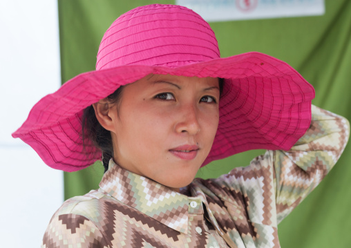 Portrait of a North Korean woman with a red hat, Pyongan Province, Pyongyang, North Korea