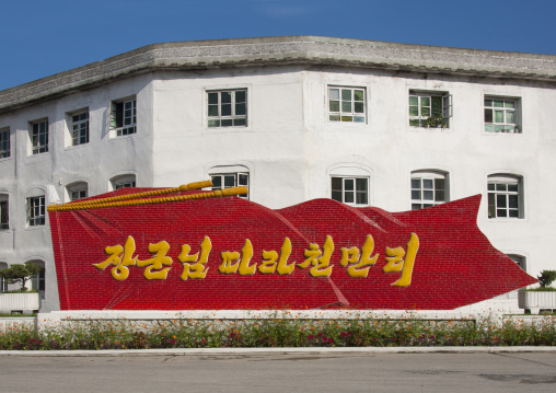 Propaganda slogan in front of apartment block, North Hamgyong Province, Chilbo Sea, North Korea