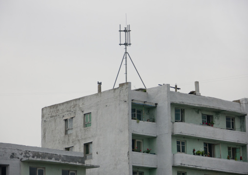 Cell phone network mast on the top of a residential building, Kangwon Province, Wonsan, North Korea