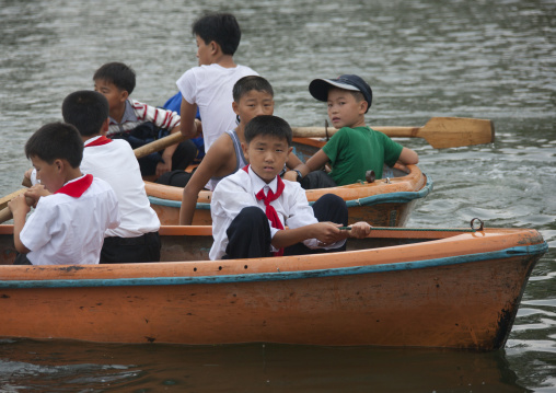 North Korean pioneers in rowing boats in Songdowon international children's union camp, Kangwon Province, Wonsan, North Korea