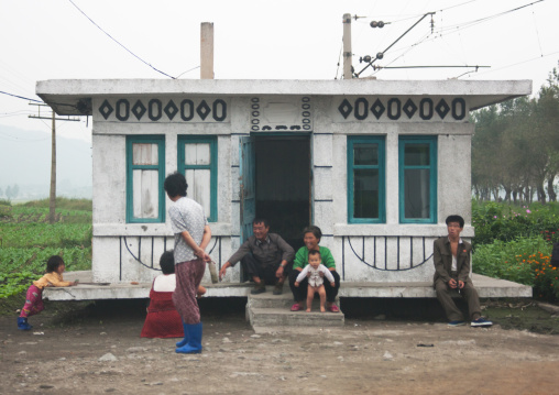 North Korean family in front of a small house, South Hamgyong Province, Hamhung, North Korea