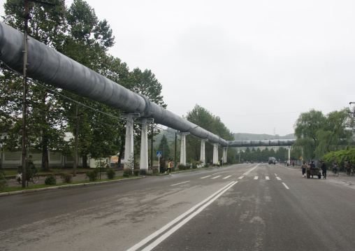 Giant pipe for heating alongside an empty road, South Hamgyong Province, Hamhung, North Korea