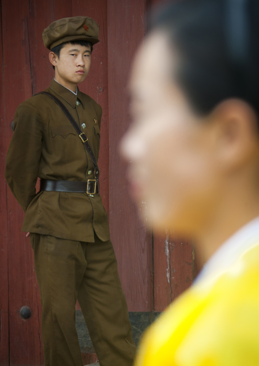 North Korean woman and a guard watching, South Hamgyong Province, Hamhung, North Korea