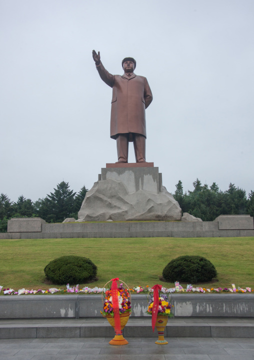Bunches of flowers in front of Kim il Sung statue, South Hamgyong Province, Hamhung, North Korea