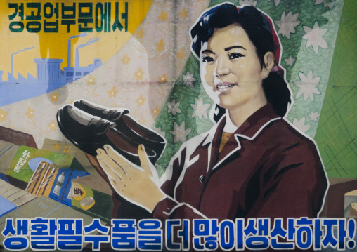 Advertisement of a North Korean woman holding shoes, South Hamgyong Province, Hamhung, North Korea