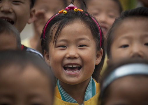 North Korean young girl smiling in a school, South Hamgyong Province, Hamhung, North Korea