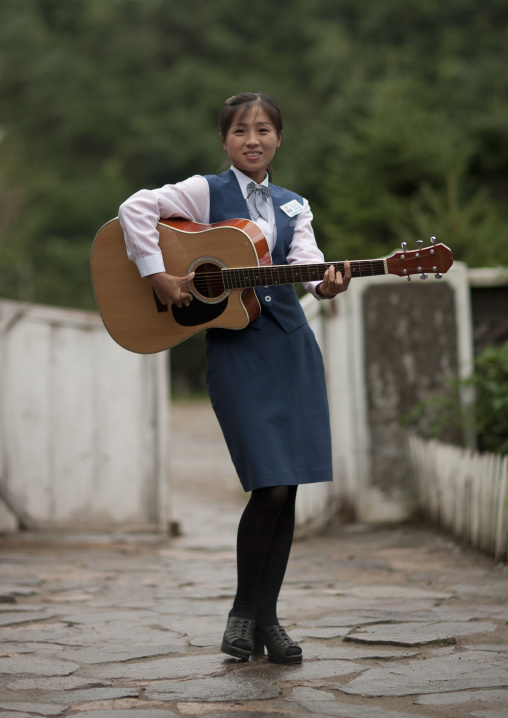 North Korean woman playing guitar, North Hamgyong Province, Jung Pyong Ri, North Korea
