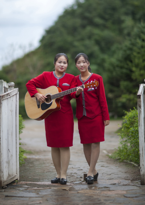 Norrth Korean young women with a guitar, North Hamgyong Province, Jung Pyong Ri, North Korea