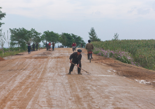 North Korean workers repairing muddy roads in the countryside, North Hamgyong Province, Jung Pyong Ri, North Korea