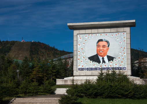 Smiling Kim il Sung on a propaganda fresco saying the great leader comrade Kim il Sung will always be with our people, Ryanggang Province, Samjiyon, North Korea