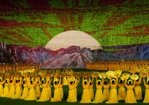 Rising sun over mount Paektu made by children pixels holding up colored boards during Arirang mass games in may day stadium, Pyongan Province, Pyongyang, North Korea