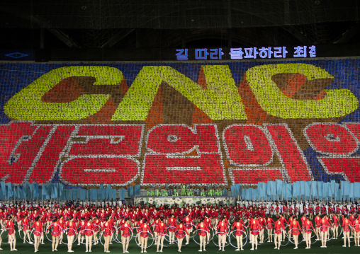 Cnc letters made by children pixels holding up colored boards during Arirang mass games in may day stadium, Pyongan Province, Pyongyang, North Korea