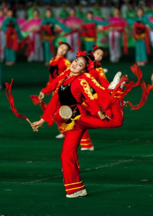 North Korean women dancing with ribbons during the Arirang mass games in may day stadium, Pyongan Province, Pyongyang, North Korea