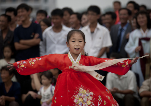North Korean young girl dancing in traditional choson-ot on national day, Pyongan Province, Pyongyang, North Korea