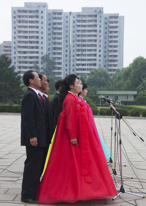 North Korean state artists singing on national day in the street, Pyongan Province, Pyongyang, North Korea