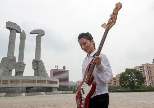 North Korean state artist performing on national day in front of the monument to Party founding, Pyongan Province, Pyongyang, North Korea