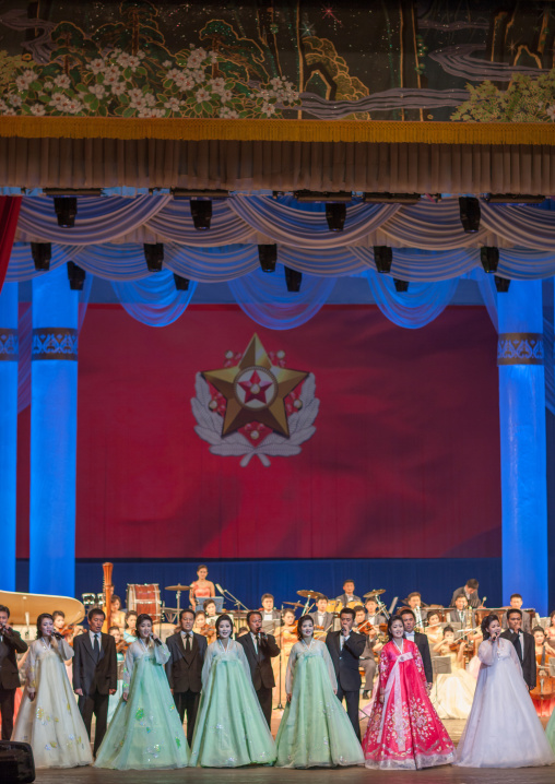 North Korean artists during eugene oneguine opera in front of the flag of the supreme commander of the Korean people's army, Pyongan Province, Pyongyang, North Korea