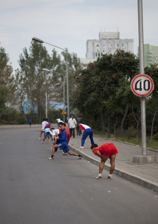 North Korean young people stretching in the street, Pyongan Province, Pyongyang, North Korea
