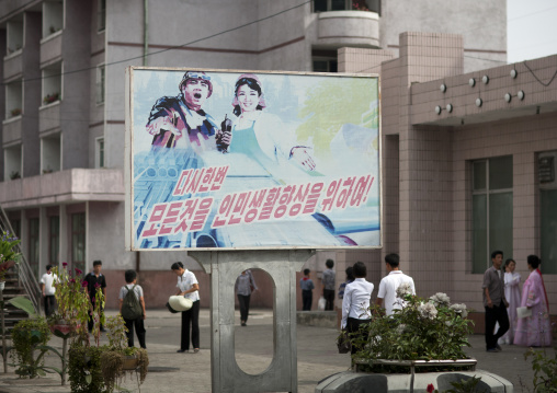 North Korean propaganda billboard with dull colors in the street, Pyongan Province, Pyongyang, North Korea