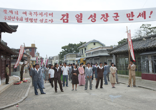 North Korean actors during a movie shooting  with the slogan long live general Kim Il-sung, The brilliant leader of our people and incomparable patriot, Pyongan Province, Pyongyang, North Kor