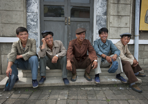 North Korean actors sitting on steps at Pyongyang film studio, Pyongan Province, Pyongyang, North Korea