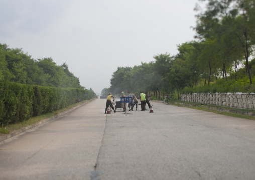 Group of North Korean workers repairing the highway, Pyongan Province, Pyongyang, North Korea