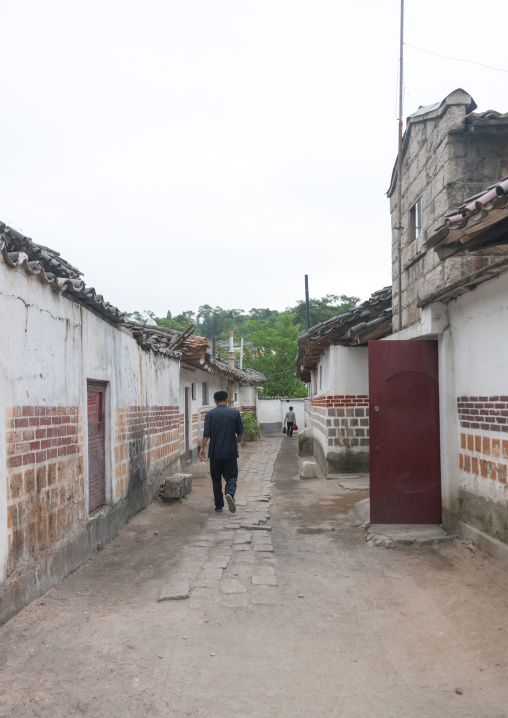 North Korean man passing through a street of the old town, North Hwanghae Province, Kaesong, North Korea