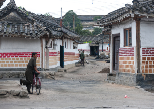North Korean men in a street of the old quarter, North Hwanghae Province, Kaesong, North Korea