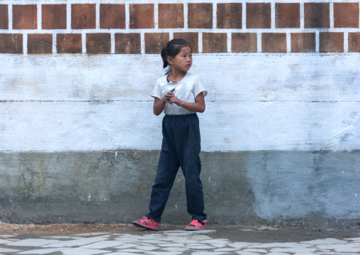North Korean girl in a street of the old quarter, North Hwanghae Province, Kaesong, North Korea