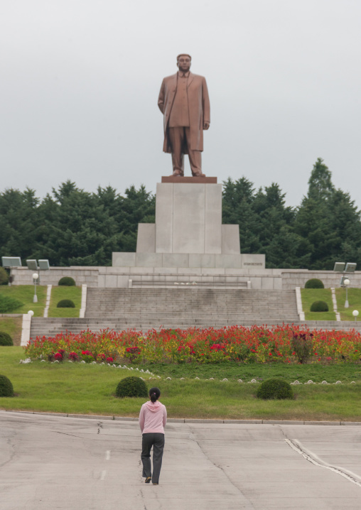 North Korean girl in front of Dear leader Kim il Sung statue, North Hwanghae Province, Kaesong, North Korea